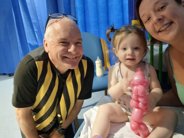 Colonel Custard with young patient at Stoke Mandeville Hospital