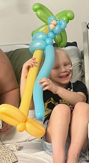 Laughing child with balloon model